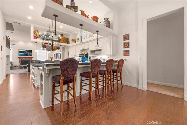 a view of a livingroom with workspace and a window