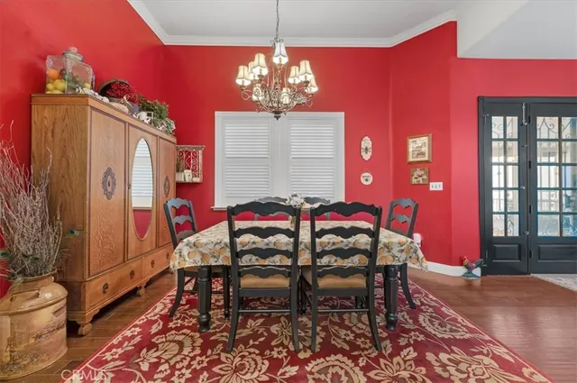 a view of a livingroom with workspace and a window