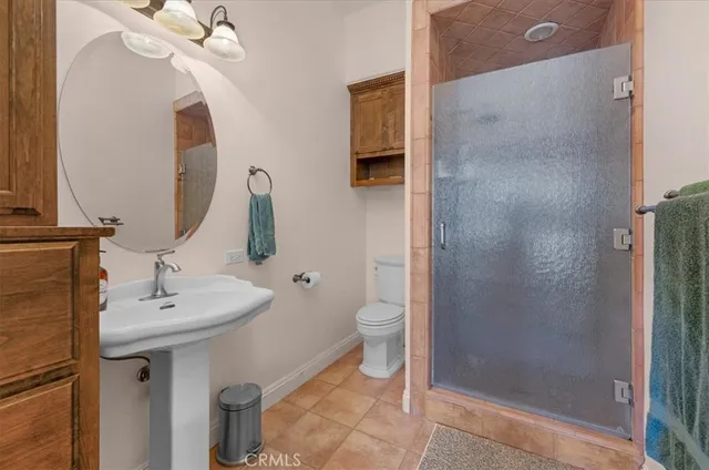 a bathroom with a sink a mirror and a window