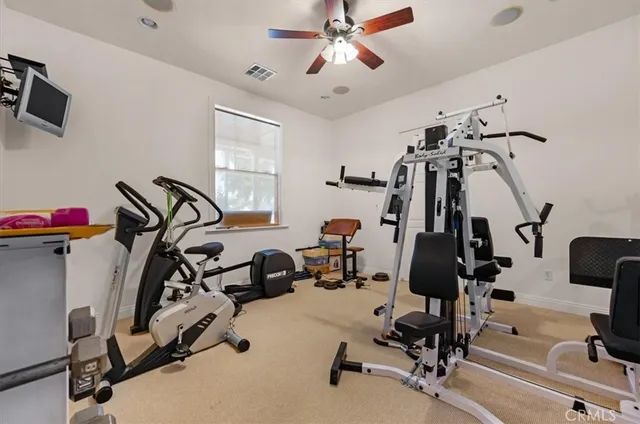 a spacious bathroom with a sink and a mirror