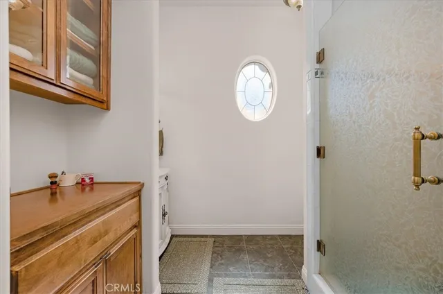 a bathroom with a bathtub and a window
