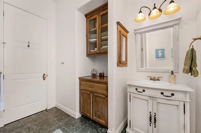 a view of a balcony with a floor to ceiling window next to a yard