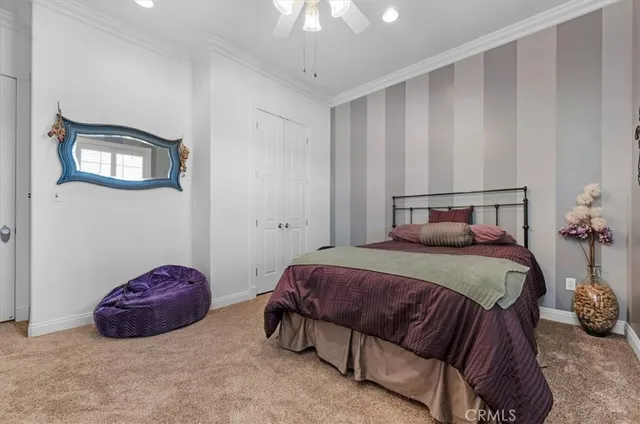 a view of a patio with table and chairs and potted plants with wooden floor and fence