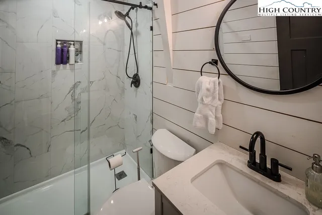 a bathroom with a sink and mirror