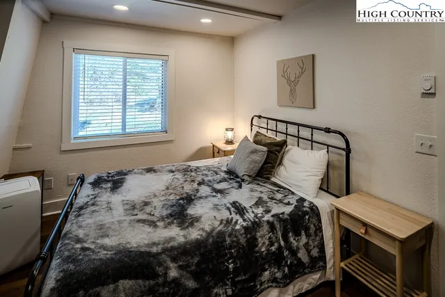 a view of balcony with wooden floor and outdoor seating