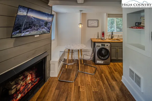 a dining room with furniture and window