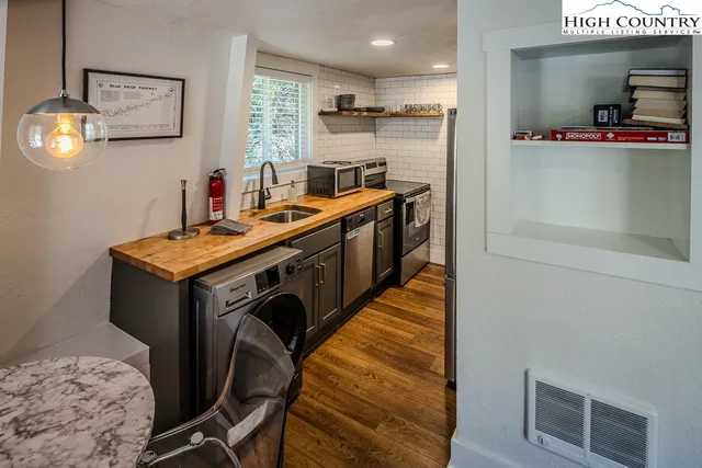 a utility room with washing machine