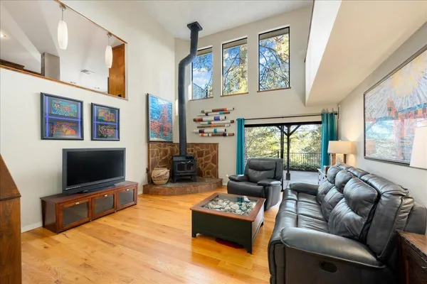 a living room with fireplace furniture and a flat screen tv
