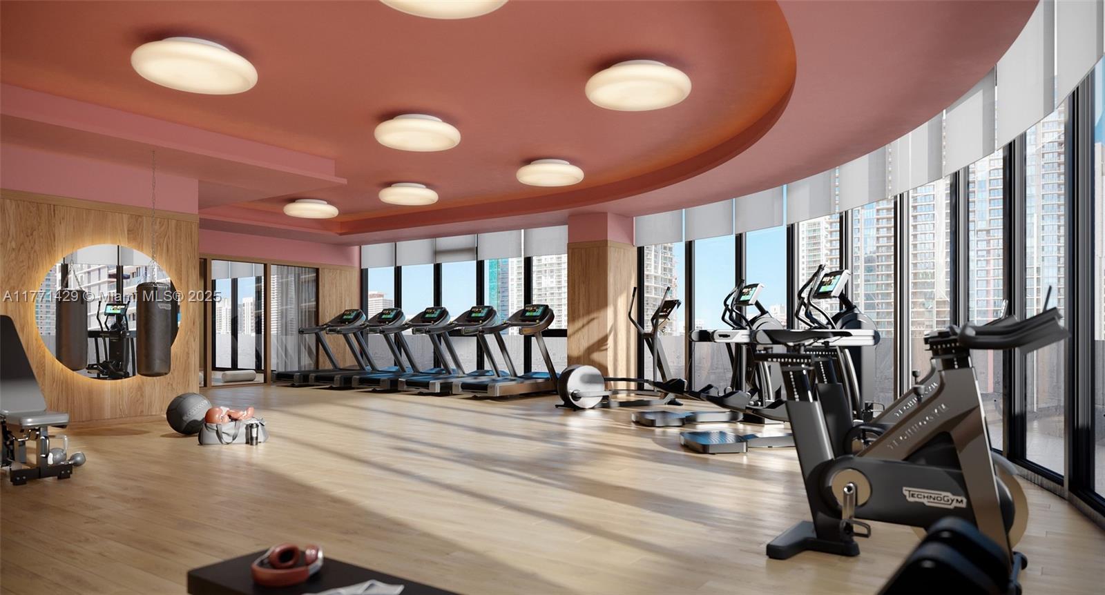 690 Southwest 1st Avenue, Unit 2610 Miami, FL 33130 - Photo 8 of 23 a view of a room with gym equipment