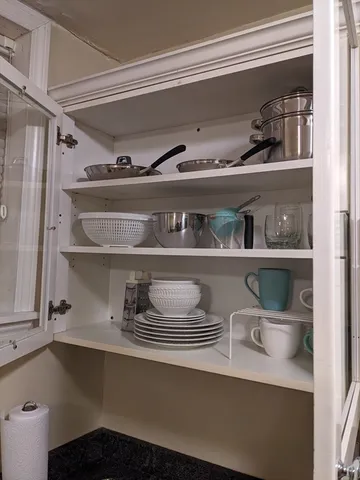 a close view of water heater and cabinets