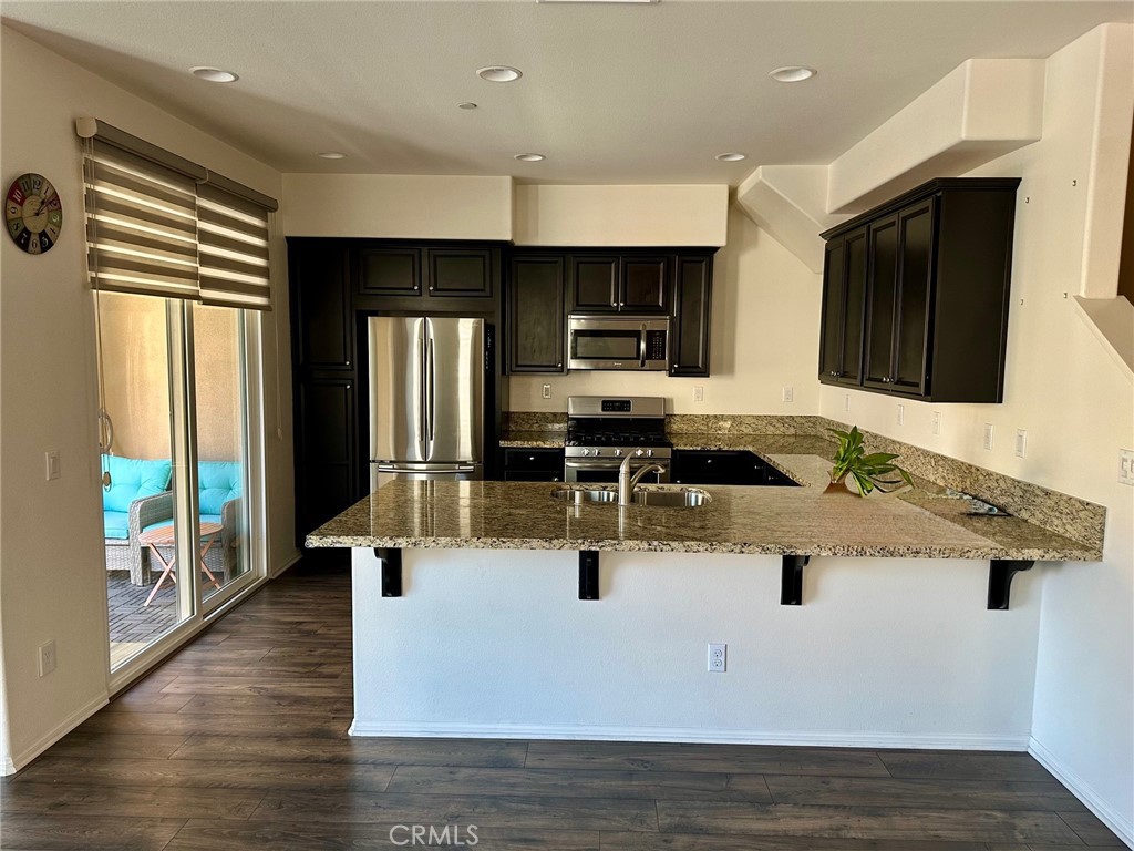 422 West Rte 66, Unit 87 Glendora, CA 91740 - Photo 21 of 35 a view of kitchen with kitchen island stainless steel appliances a sink and counter space