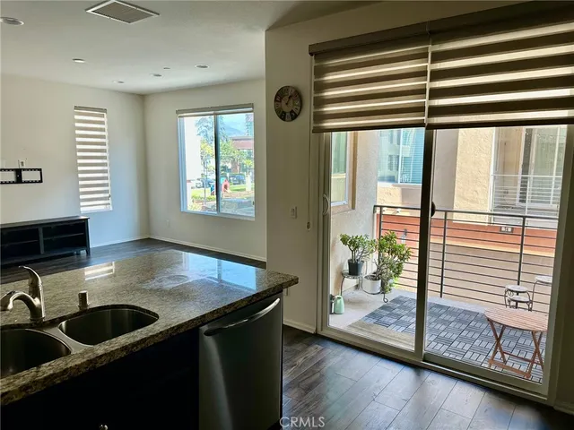 a kitchen with a large window and a sink