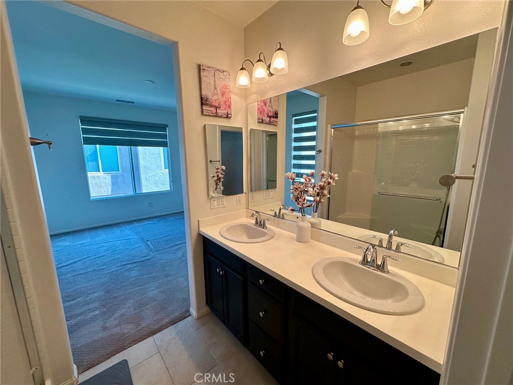 422 West Rte 66, Unit 87 Glendora, CA 91740 - Photo 26 of 35 a bathroom with a sink double vanity and a mirror