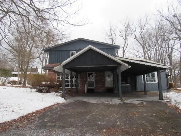 a front view of a house with a yard