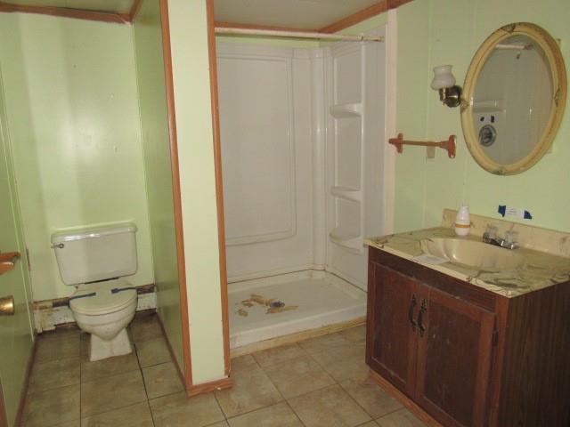 303 Lemmon Hollow Road Kittanning, PA 16201 - Photo 13 of 17 a bathroom with a granite countertop sink a toilet and shower