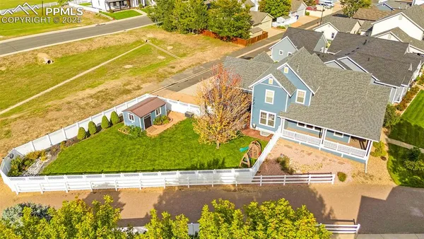 a view of swimming pool with a yard and plants