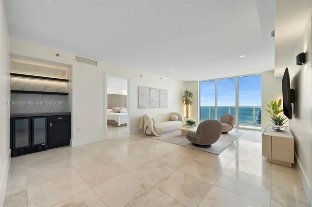 a bedroom with furniture and a flat screen tv