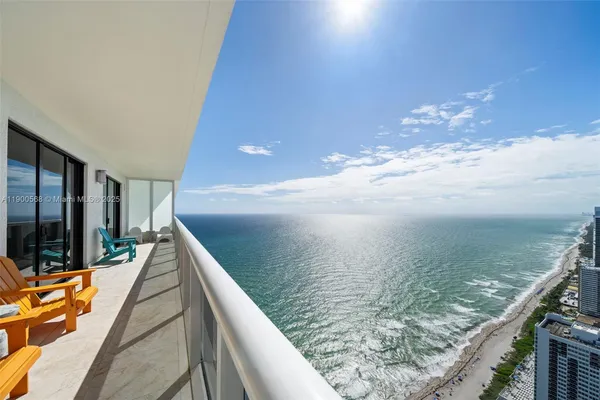 a view of swimming pool from a balcony