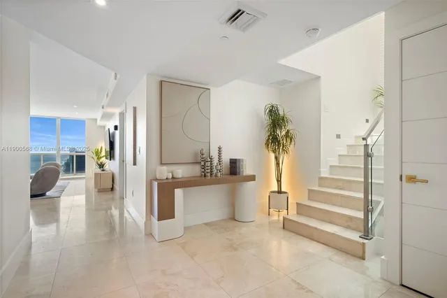 a view of a living room and entry way