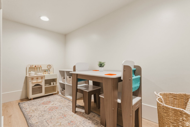 923 North Emery Lane Elk Ridge, UT 84651 - Photo 51 of 101 Recessed ceiling lighting illuminates this versatile room, featuring light wood-finish flooring and neutral wall tones