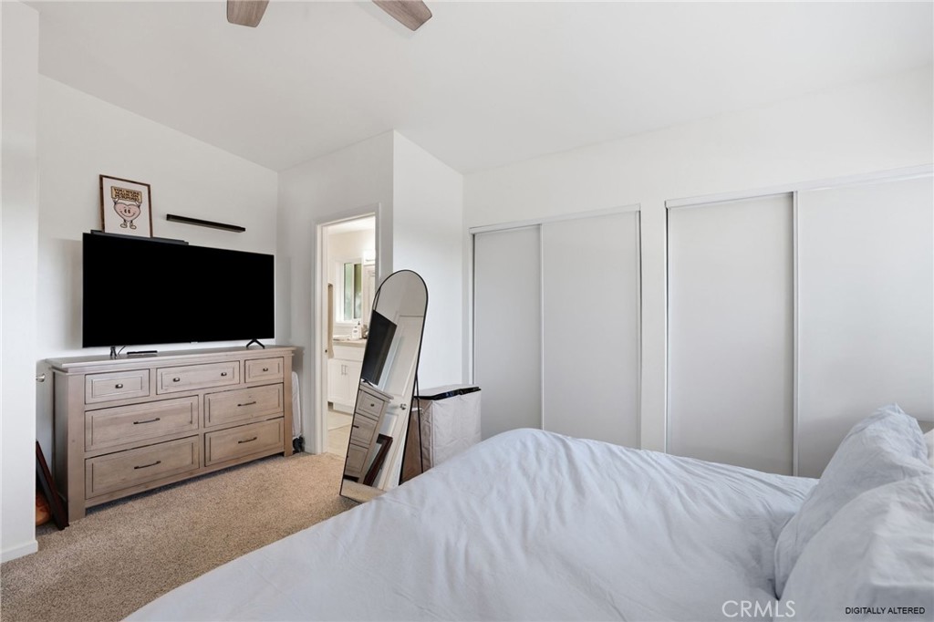 3370 Pachappa Hill Riverside, CA 92506 - Photo 14 of 36 a bedroom with a bed and flat screen tv