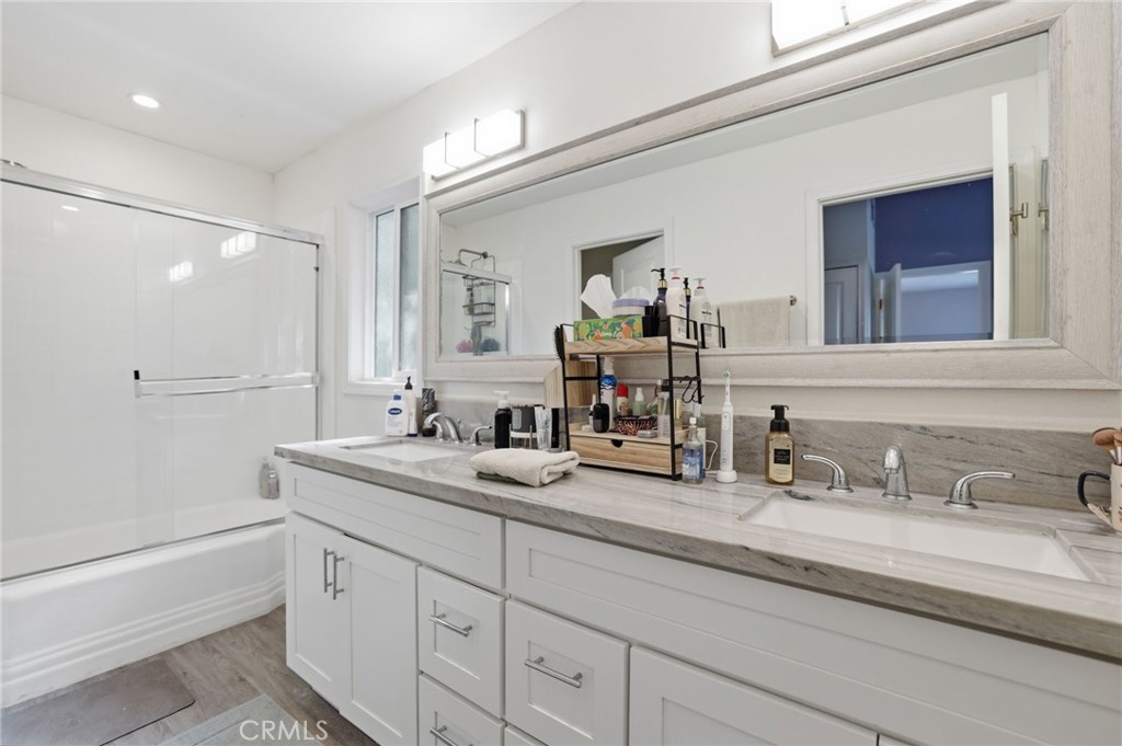 3370 Pachappa Hill Riverside, CA 92506 - Photo 15 of 36 a bathroom with double sink and a mirror