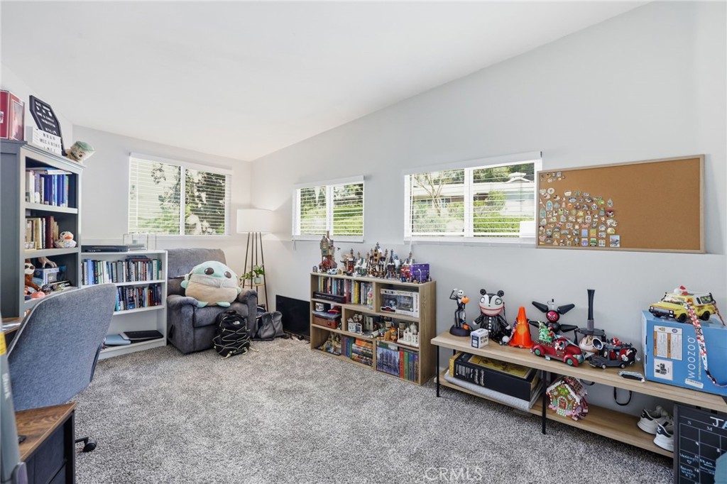 3370 Pachappa Hill Riverside, CA 92506 - Photo 16 of 36 a room with furniture toys and a book shelf