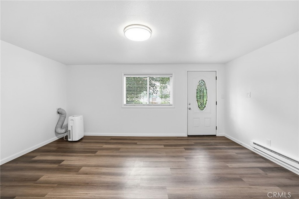 3370 Pachappa Hill Riverside, CA 92506 - Photo 21 of 36 an empty room with wooden floor and window
