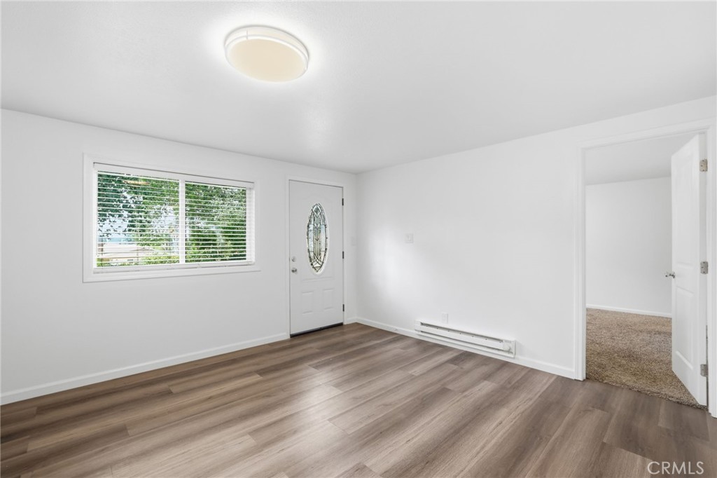 3370 Pachappa Hill Riverside, CA 92506 - Photo 22 of 36 an empty room with wooden floor and windows