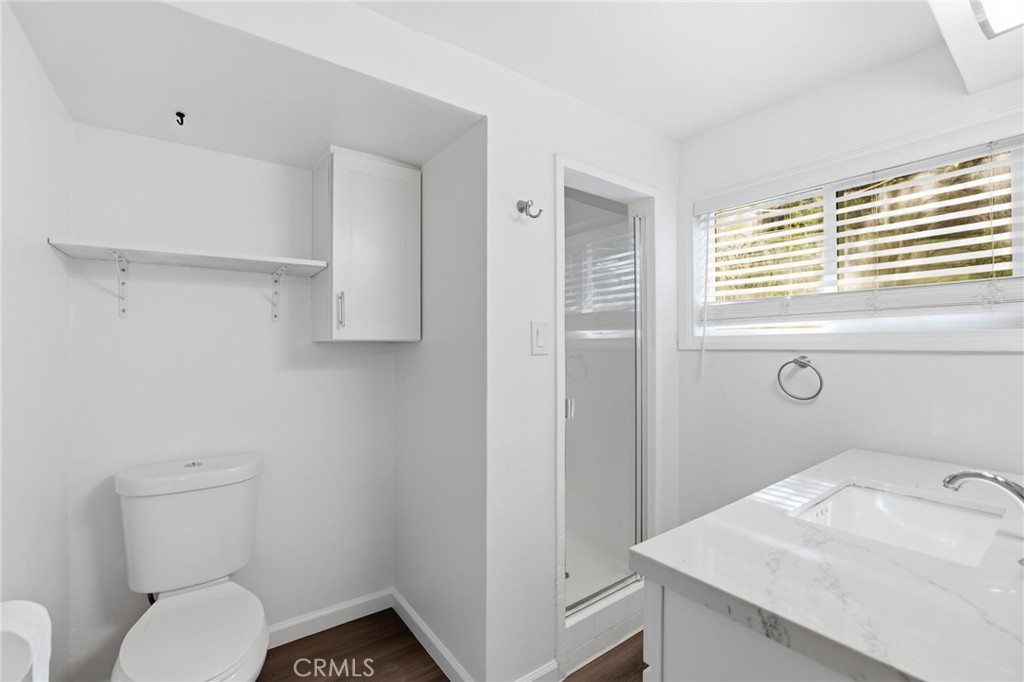 3370 Pachappa Hill Riverside, CA 92506 - Photo 30 of 36 a bathroom with a sink toilet and window