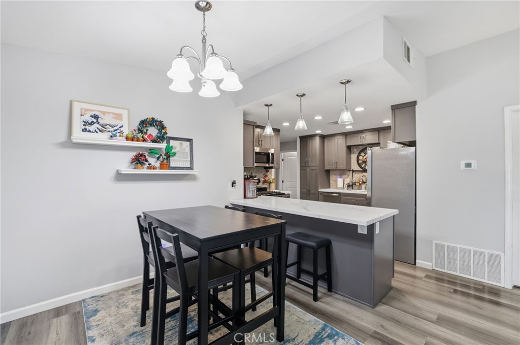 3370 Pachappa Hill Riverside, CA 92506 - Photo 9 of 36 a view of a dining room with furniture and chandelier