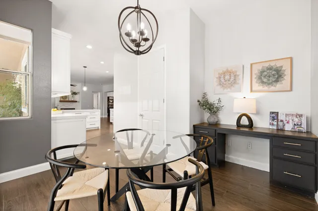 a view of a dining room with furniture and wooden floor