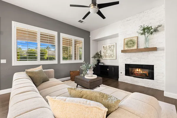 a living room with furniture and a fireplace