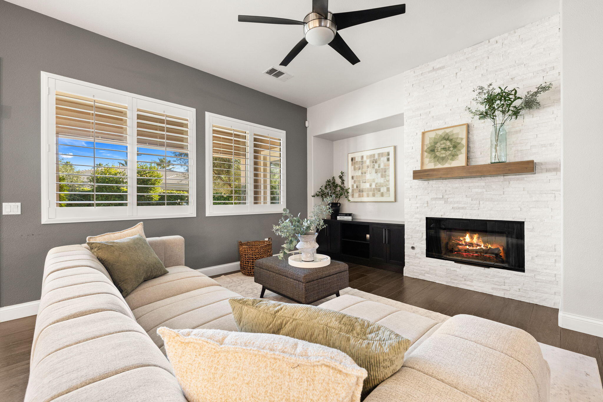 48864 Pear Street Indio, CA 92201 - Photo 2 of 46 a living room with furniture and a fireplace