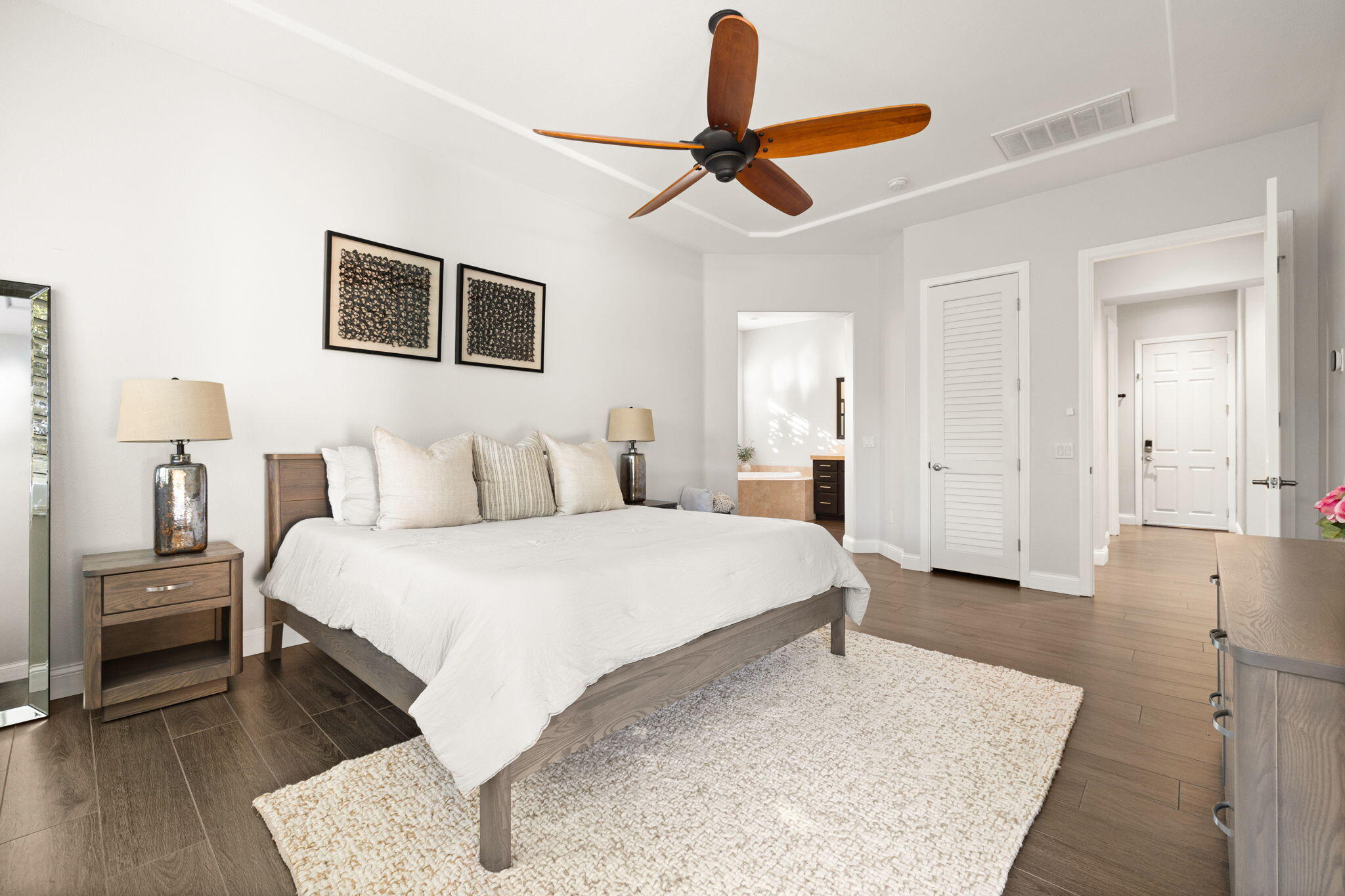 48864 Pear Street Indio, CA 92201 - Photo 21 of 46 a spacious bedroom with a bed and a ceiling fan