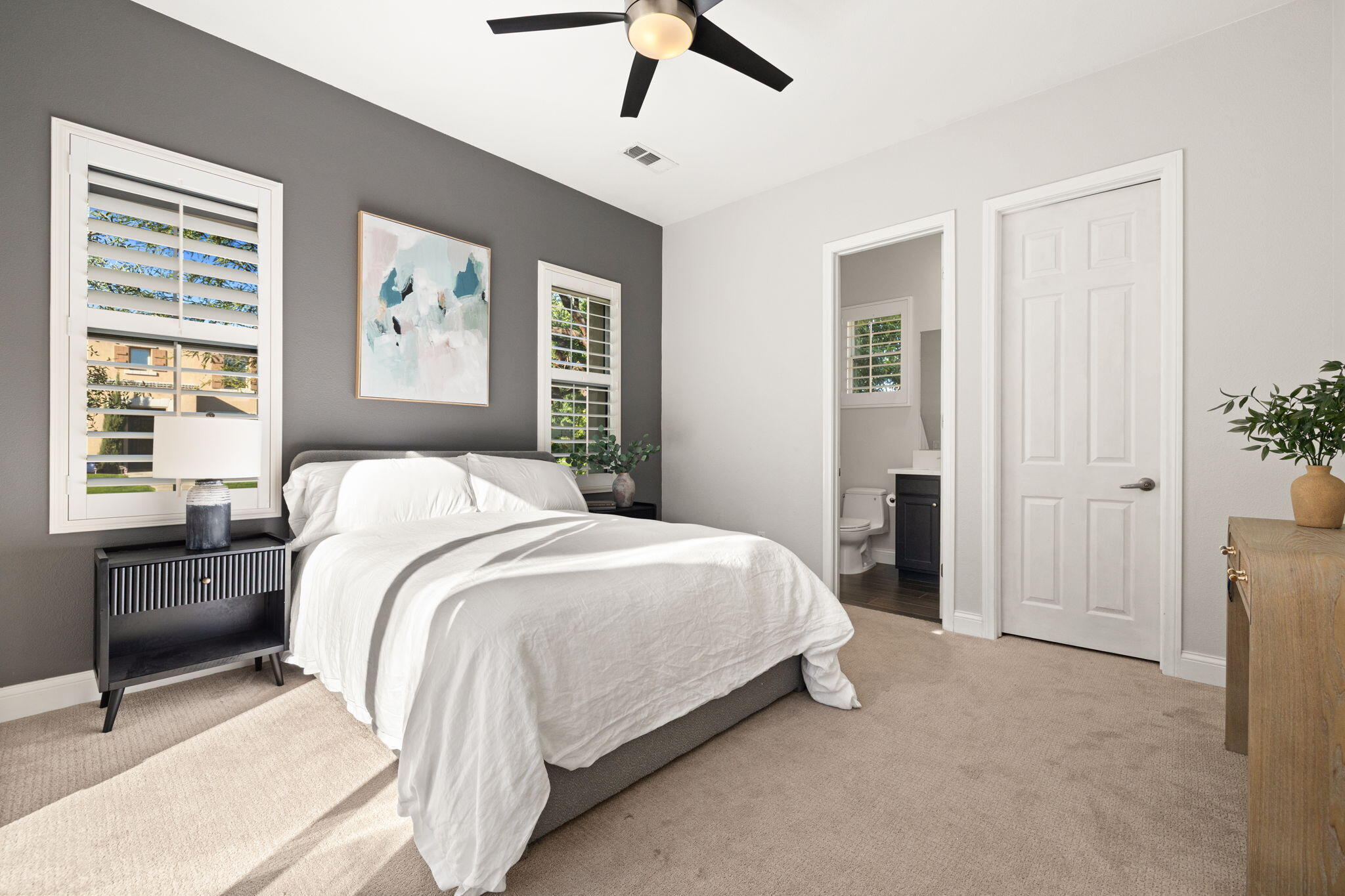 48864 Pear Street Indio, CA 92201 - Photo 26 of 46 a bedroom with a bed and painting on the wall