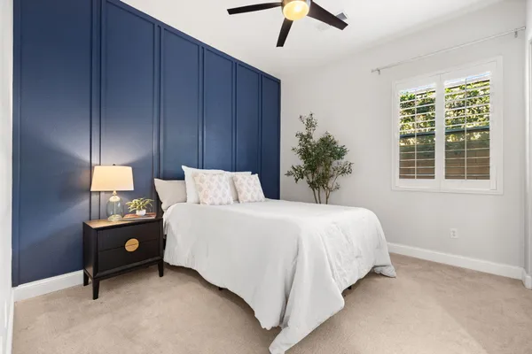 a bed room with a bed and a window