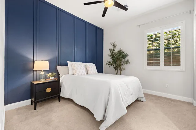 a bed room with a bed and a window