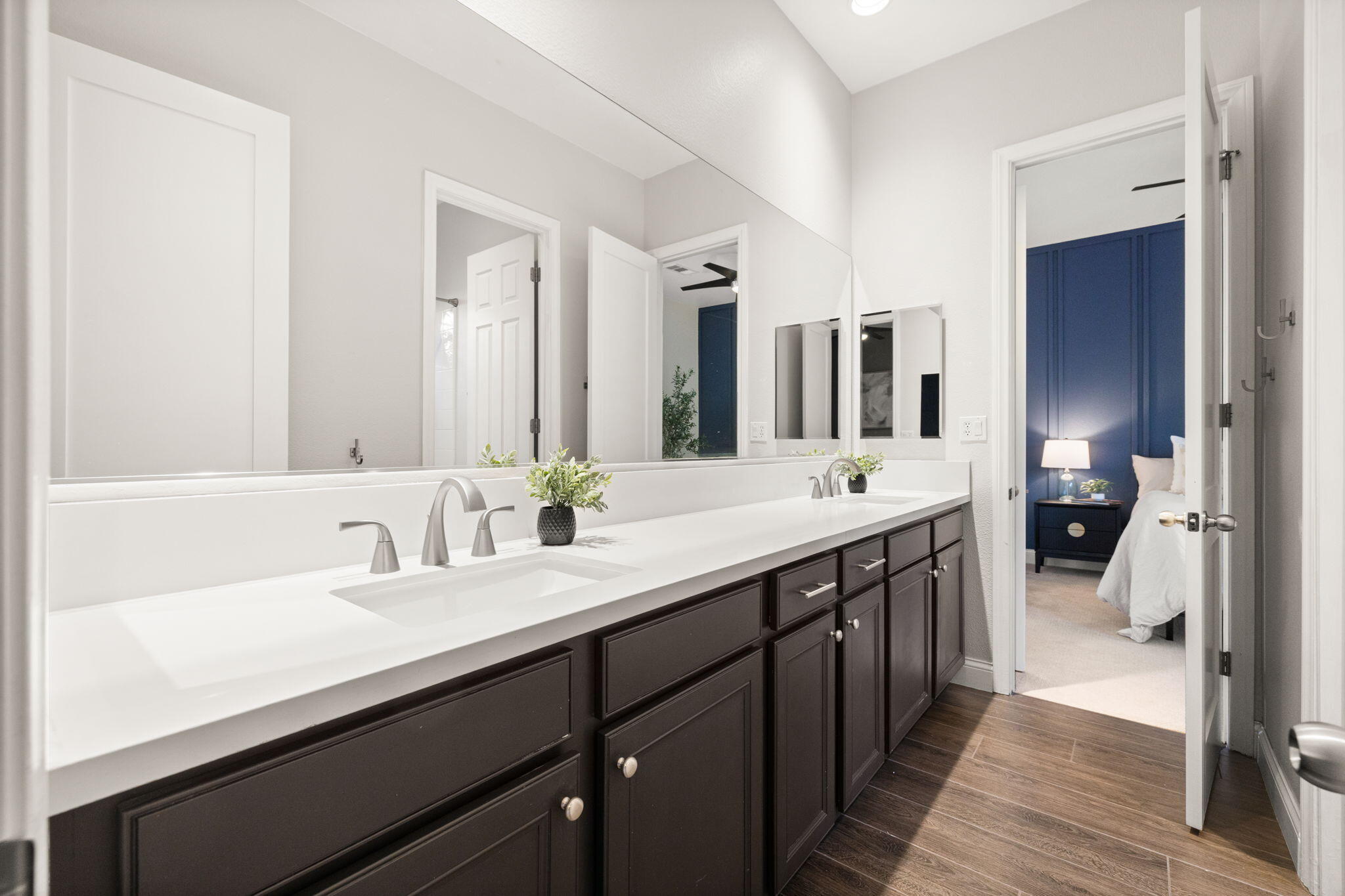 48864 Pear Street Indio, CA 92201 - Photo 32 of 46 a spacious bathroom with a double vanity sink and mirror