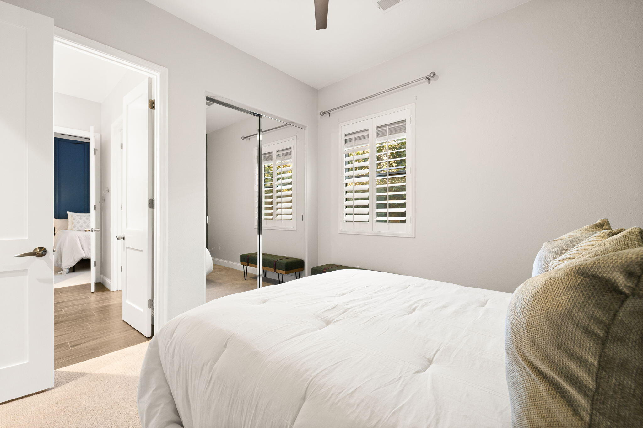 48864 Pear Street Indio, CA 92201 - Photo 35 of 46 a bedroom with a bed and a large mirror