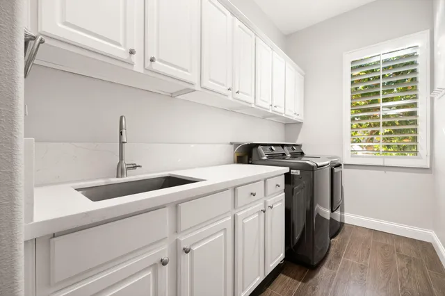 a kitchen with appliances cabinets and a sink