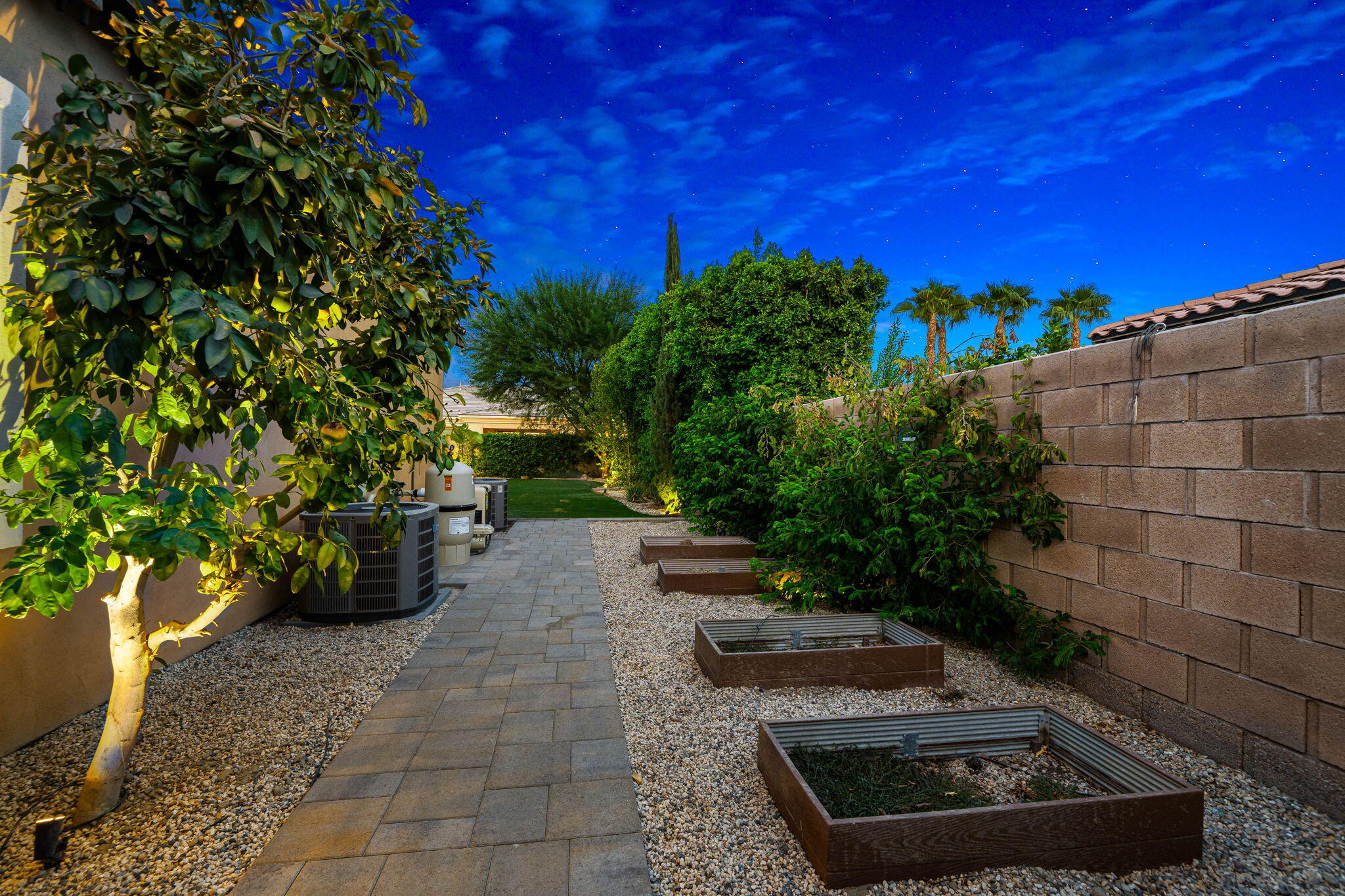48864 Pear Street Indio, CA 92201 - Photo 42 of 46 a backyard of a house with lots of green space
