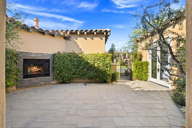 a view of a pathway with a patio