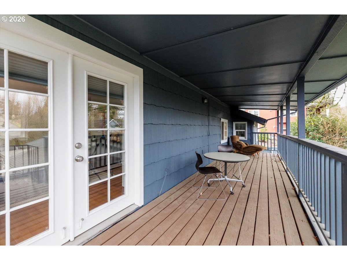 3827 Southwest Dolph Court Portland, OR 97219 - Photo 11 of 48 a view of balcony with wooden floor and seating space