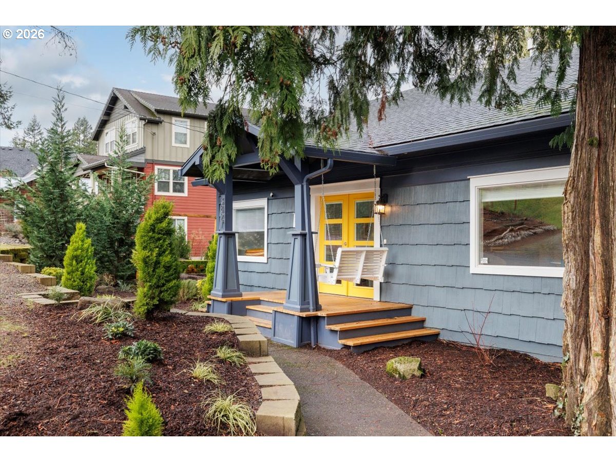 3827 Southwest Dolph Court Portland, OR 97219 - Photo 2 of 48 a small garden in the backyard of a house