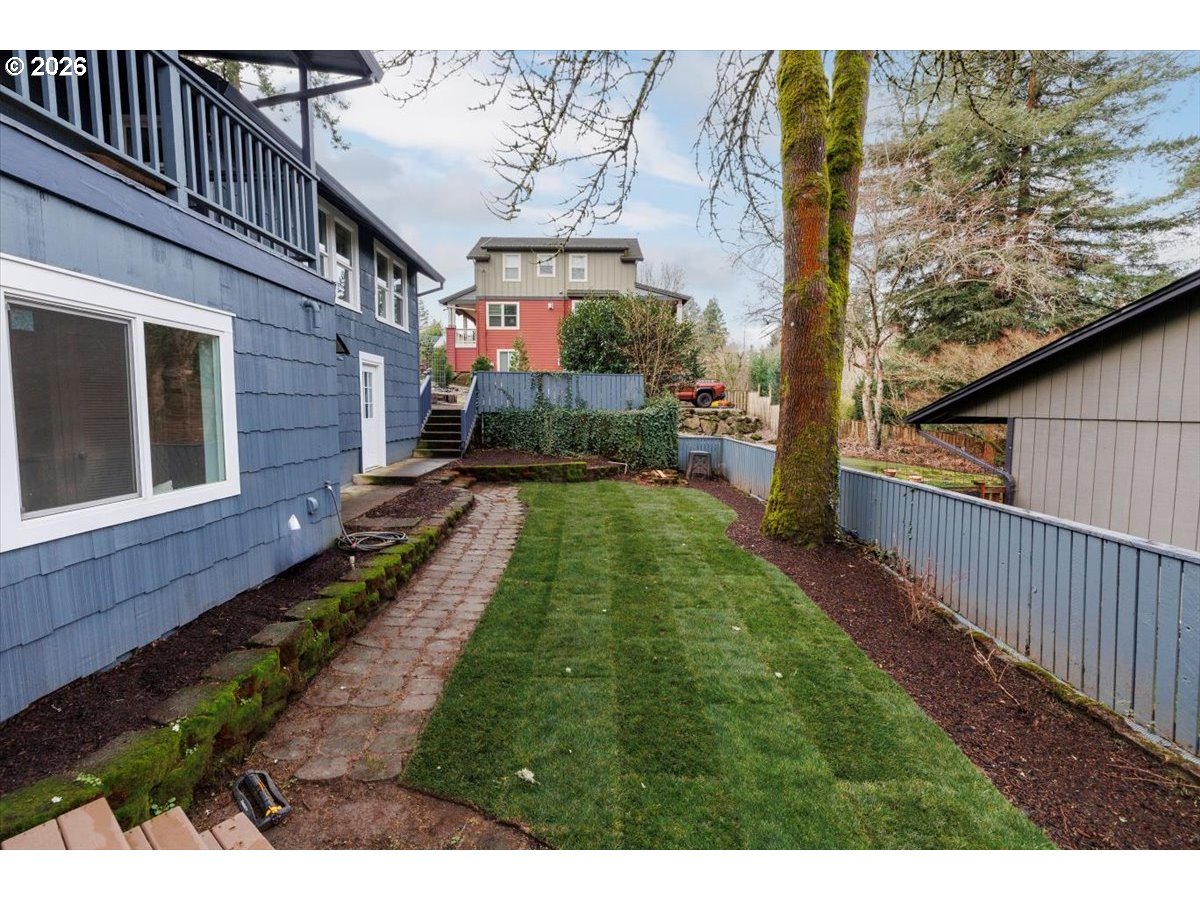 3827 Southwest Dolph Court Portland, OR 97219 - Photo 24 of 48 a balcony with view of trees in the background