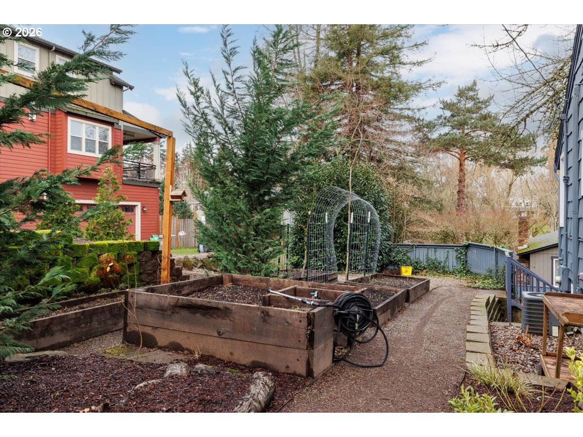 3827 Southwest Dolph Court Portland, OR 97219 - Photo 25 of 48 a backyard of a house with yard and outdoor seating