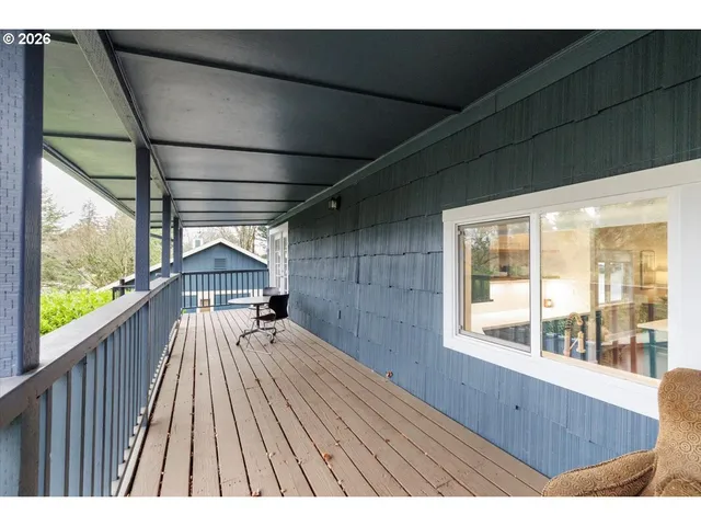 a view of a deck with wooden floor and outdoor space