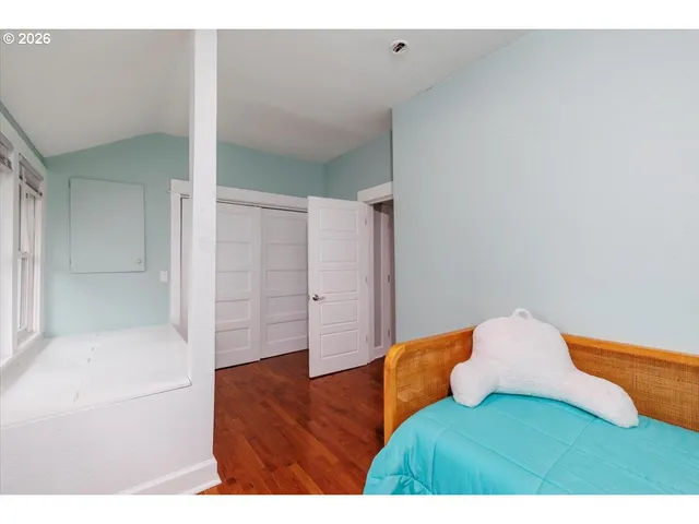 a living room with a bed