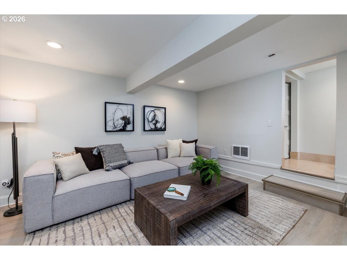 3827 Southwest Dolph Court Portland, OR 97219 - Photo 35 of 48 a living room with furniture and a wooden floor